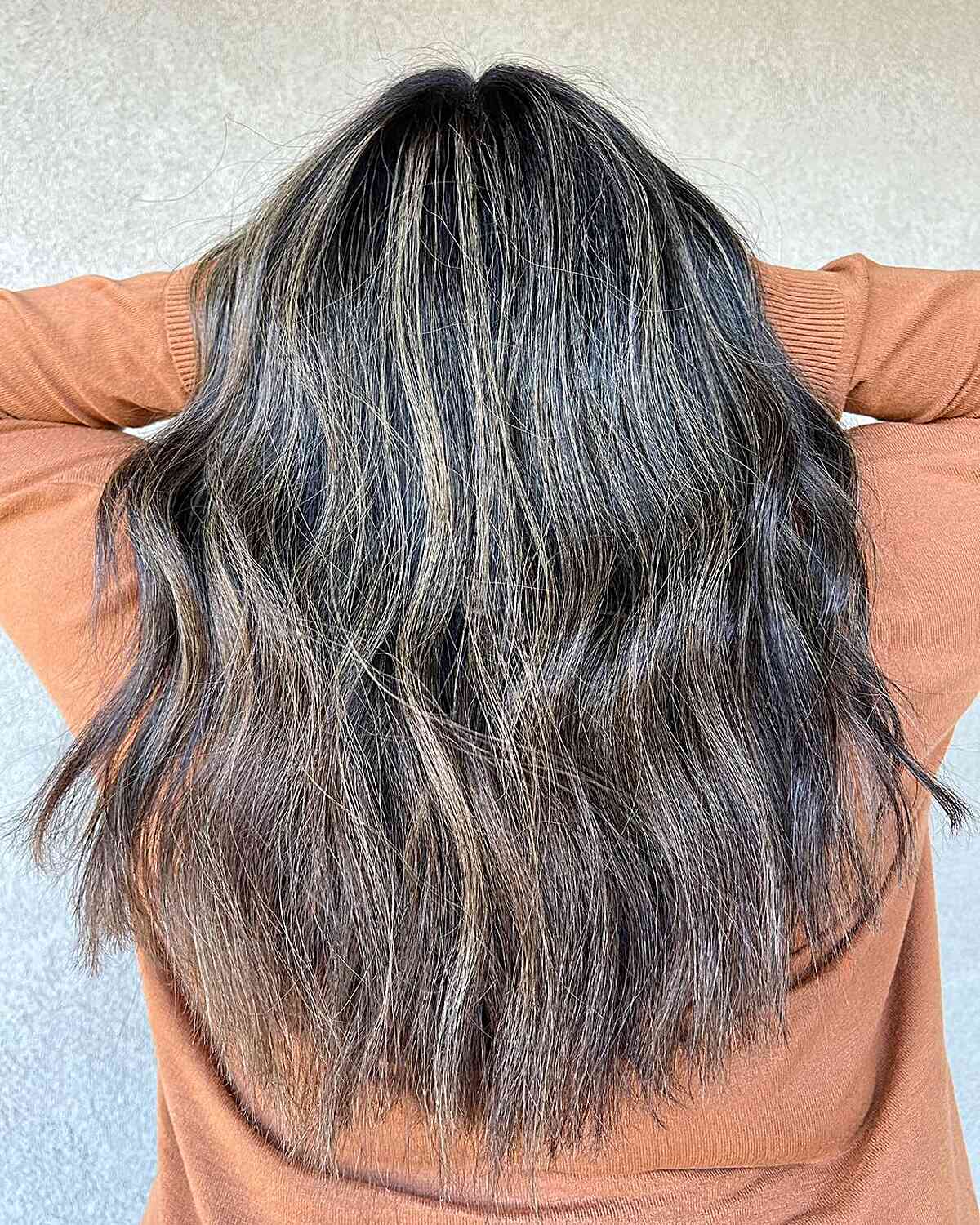 Choppy Long Deep Locks with Subtle Blonde Balayage Accents