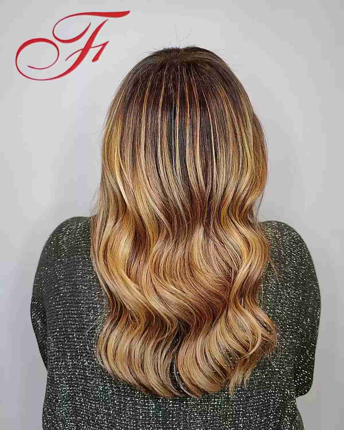 Deep-Rooted Golden Blonde with Copper Highlights on Medium-Long Haircut