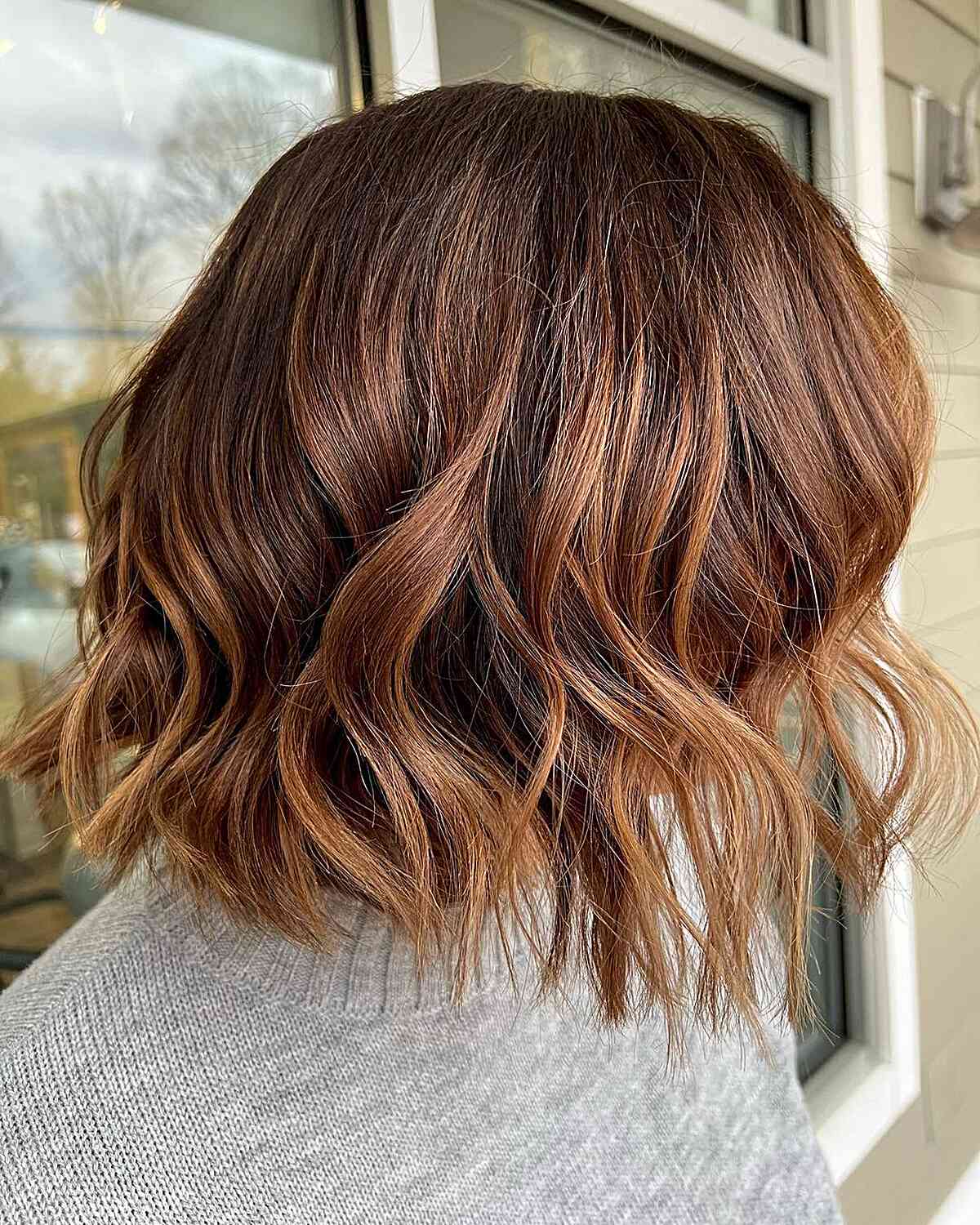 Delicate Balayage for a Short Caramel Brown Bob with Choppy Ends