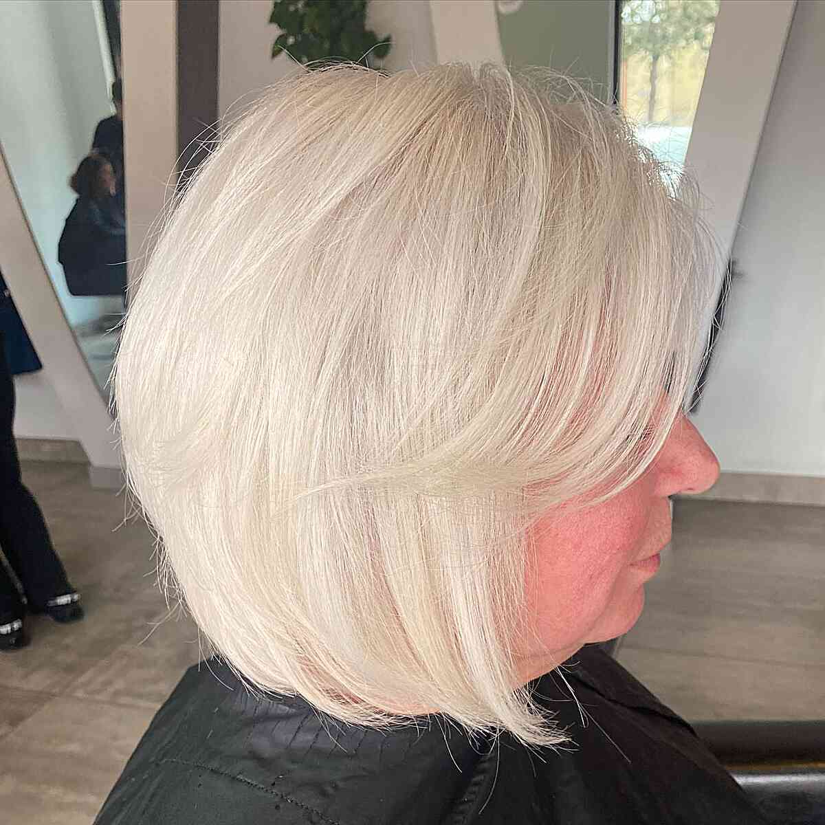 Delicate Graduated Bob with Frosty Blonde Highlights on Fine-Haired Older Ladies