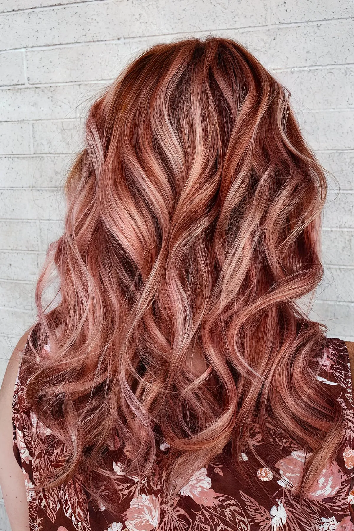 Delicate Strawberry Pink Accents on Rose Gold Locks