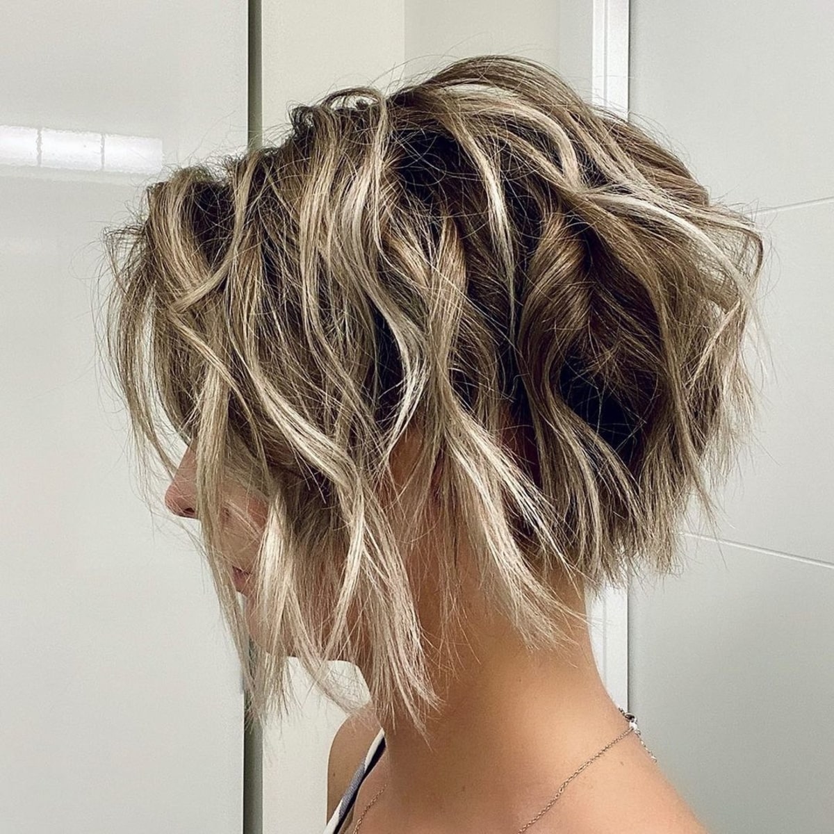 Disjointed textured style on messy bob