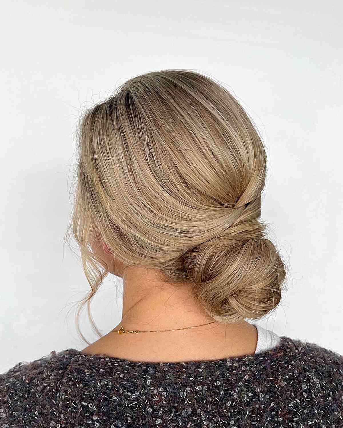 Easygoing Chignon with a Soft Face Frame for Formal Events