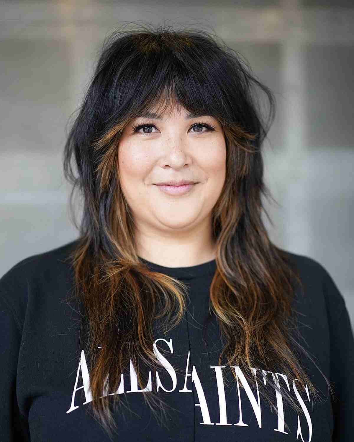 Chic Razored Shag Haircut with Bangs for Long Hair