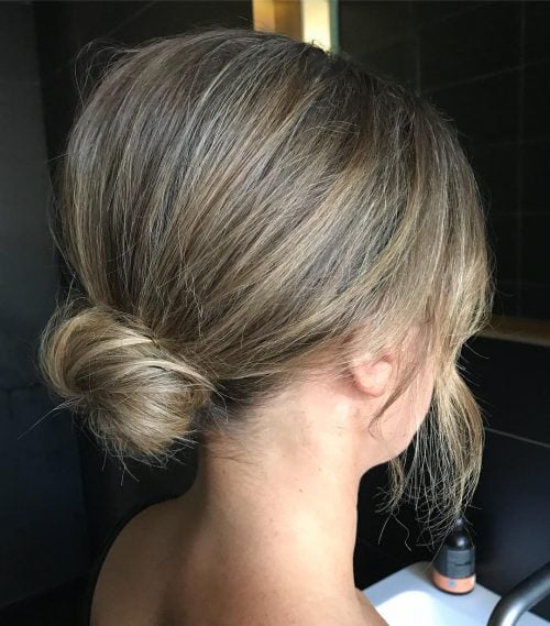 Image of effortless airy textured bun for a formal occasion