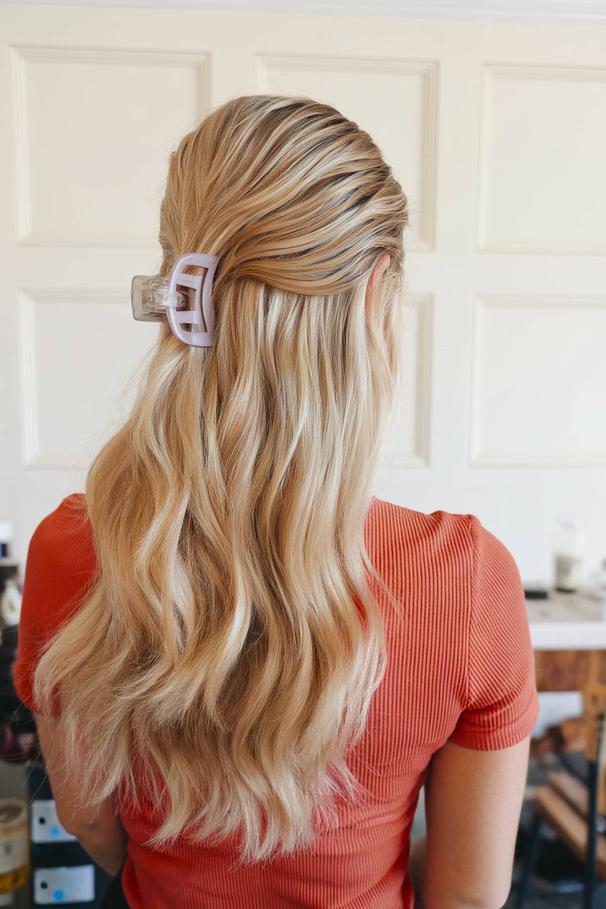 Claw clip half up hairstyle for long locks
