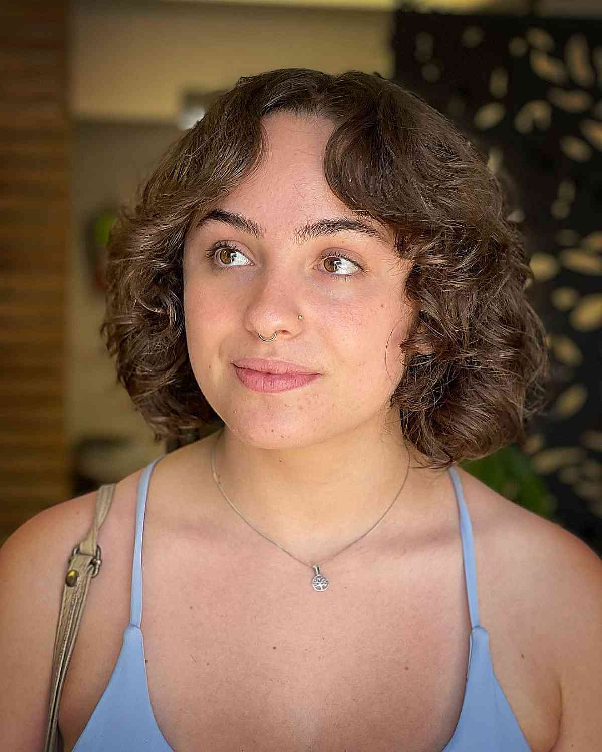 Effortless Chin-Length Curly Bob with Bangs