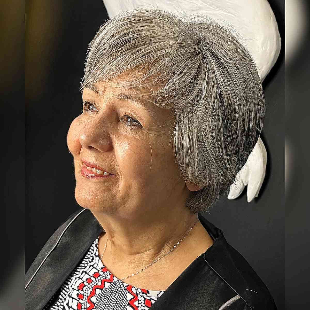 Effortless Grey Ear-Length Bob Hairstyle for Women Over 70