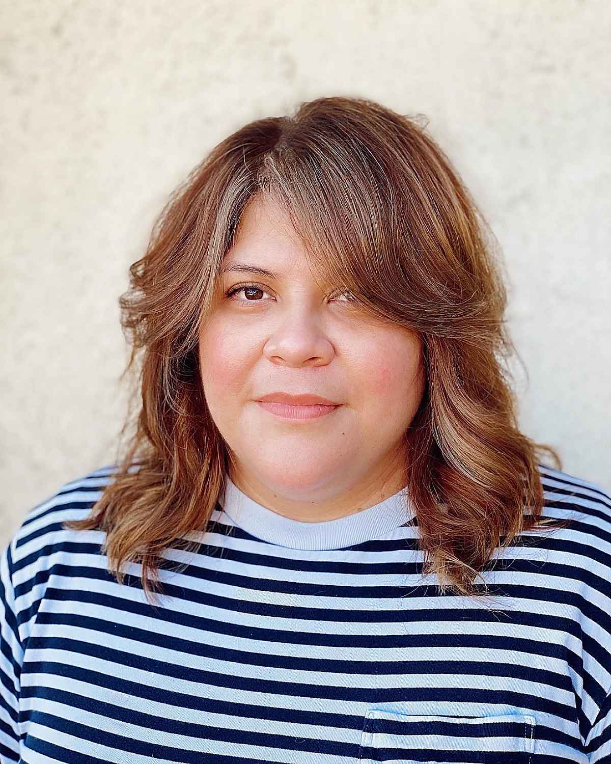 Effortless Medium Hairstyle with Curtain Bangs and Side Part