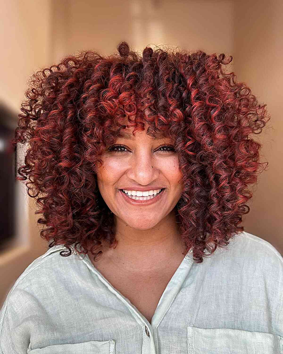 Elegant & Bold Red Balayage Curls with bright red hair dye for thick hair