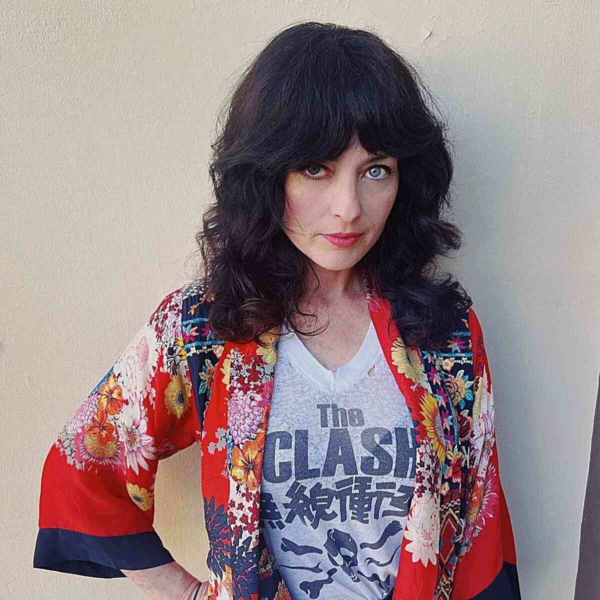 Medium-Length Elegant and Bouncy Shag with Bangs