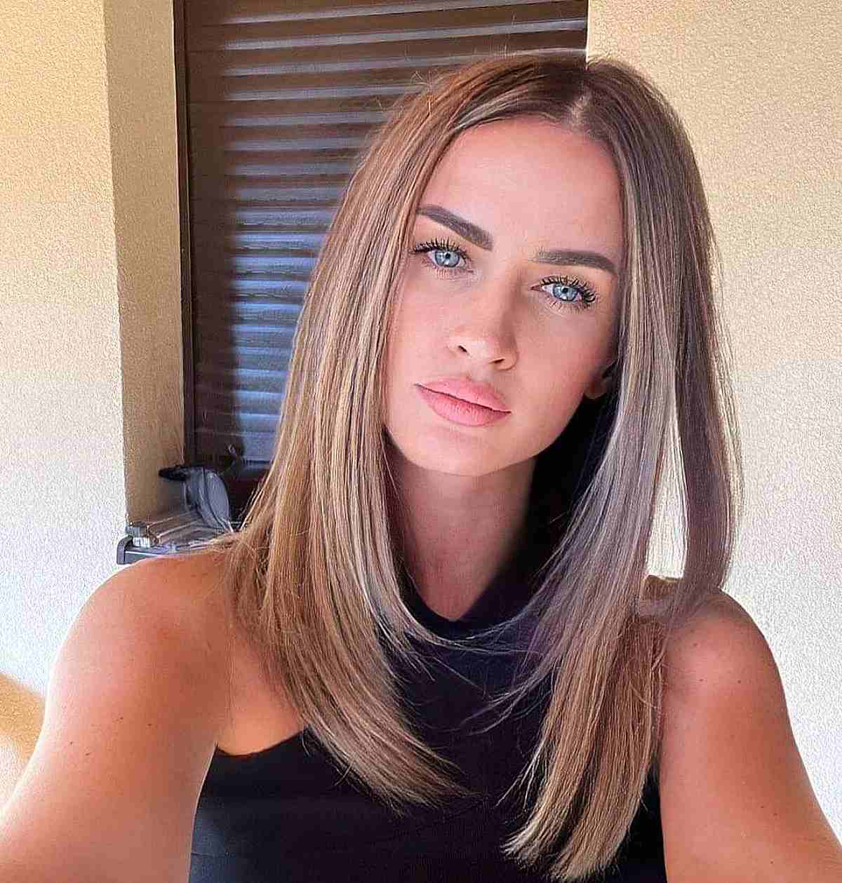 Elegant and Polished Fine Straight Hair with a Central Part