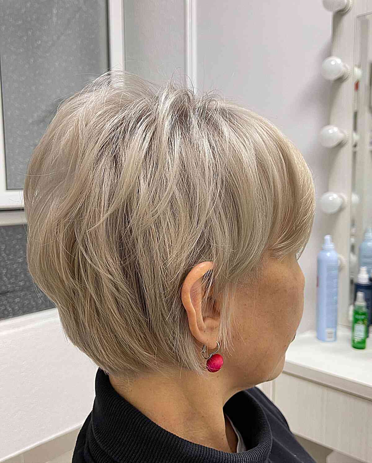 Elegant Ash Blonde Long Pixie Cut for women aged 70