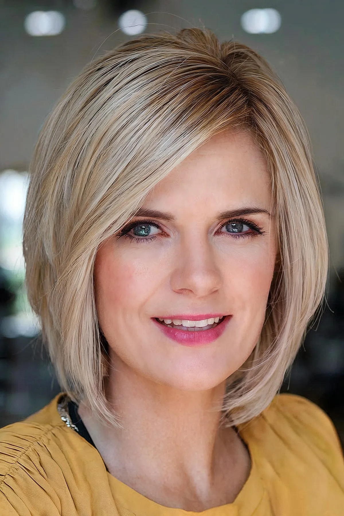 Elegant Bangs on a Short Layered Bob for women in their 40s with thick hair