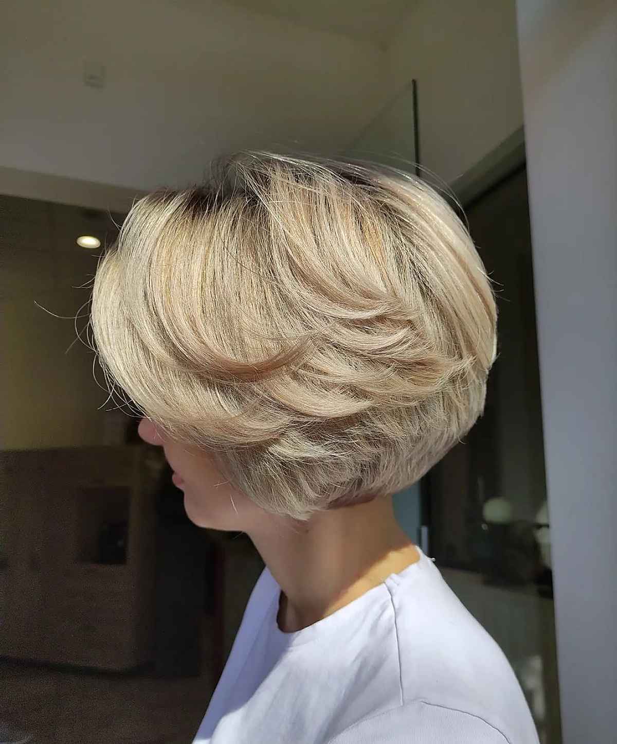 elegant blonde feathered bob hairstyle