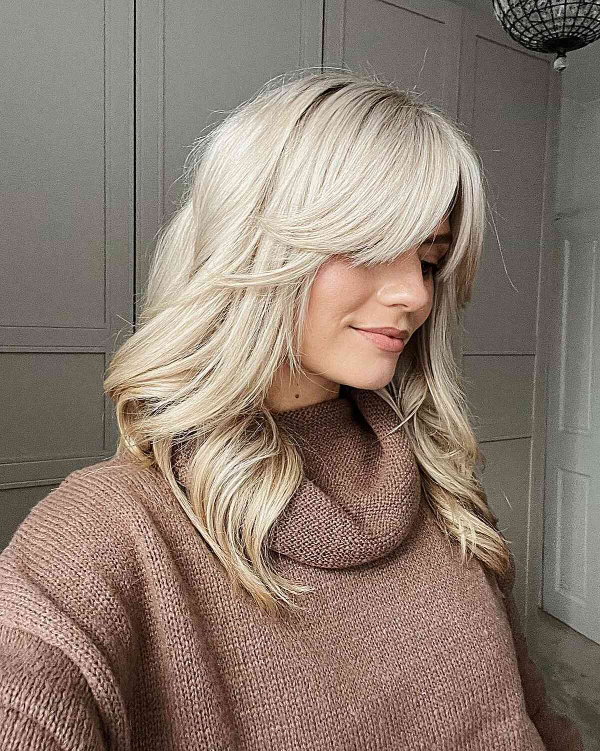 Elegant Blonde Medium-Length Hair Featuring Bangs