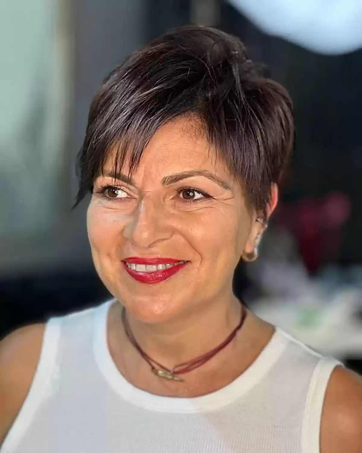 Stylish Brunette Pixie Cut for Women Over Fifty with Fine Hair