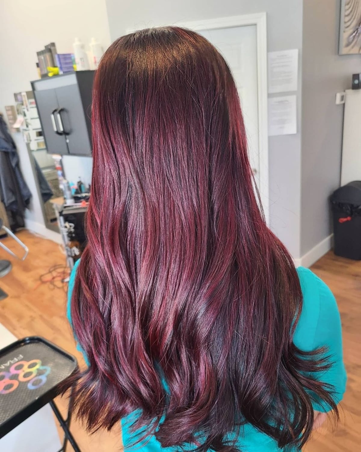 Elegant burgundy highlights on dark hair