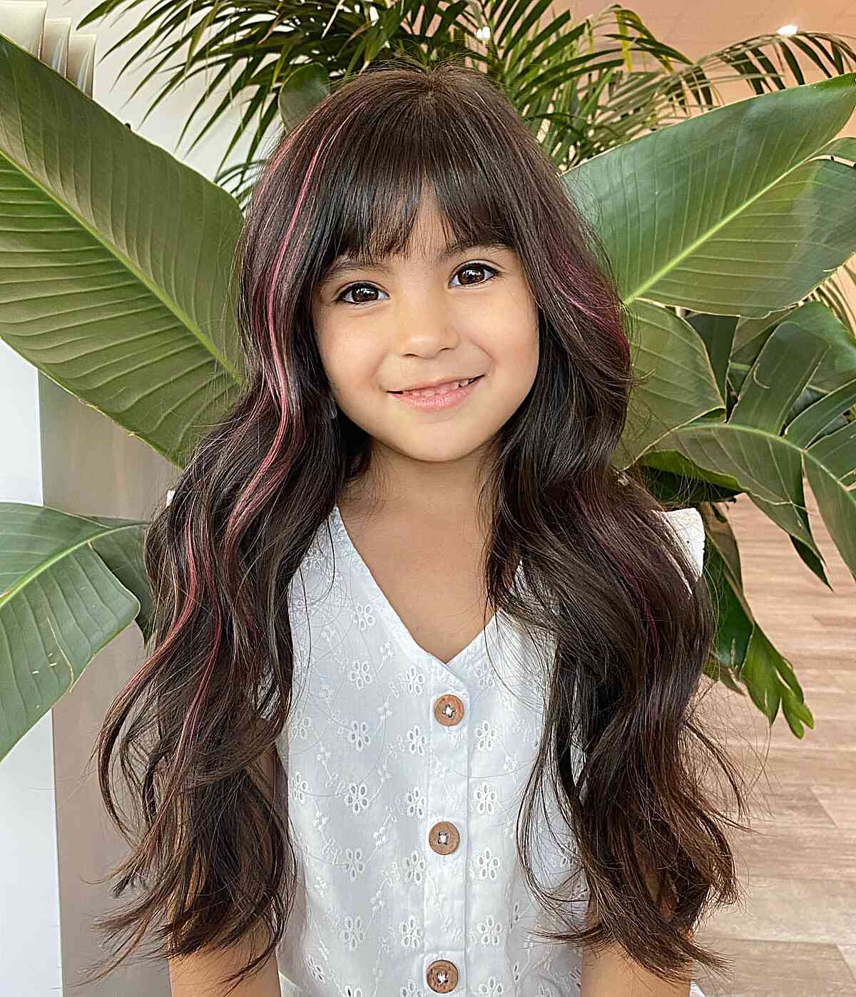 Elegant Dark Brown Hair with Bangs and Subtle Pink Highlights for Girls