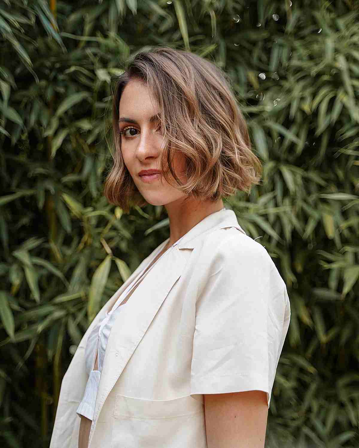 Elegant Deep Side Part on Short Bobbed Hair with Wavy Delicate Layers