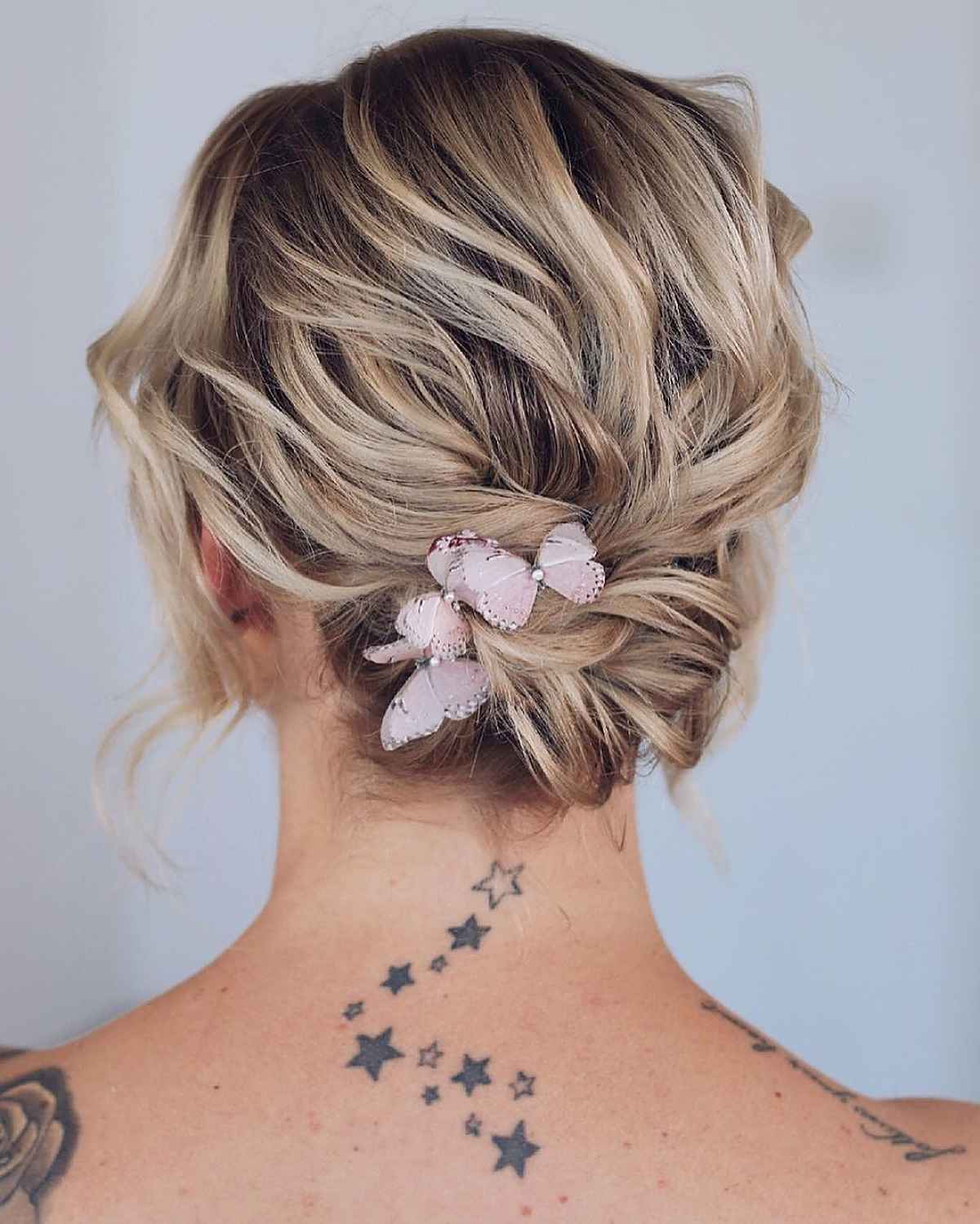 Chic feathered updo for a bob