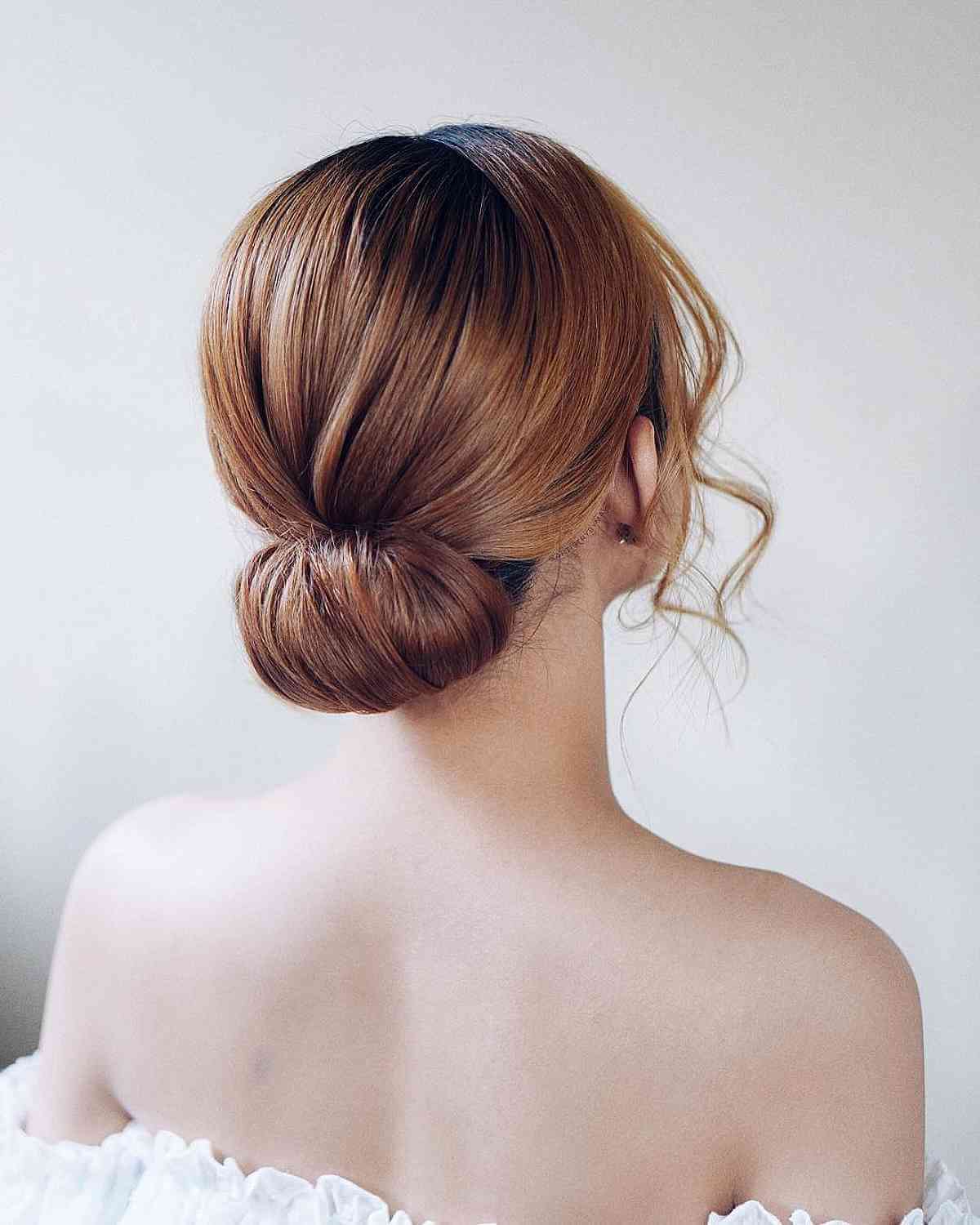 Elegant golden brown low updo for prom night formal simple updos