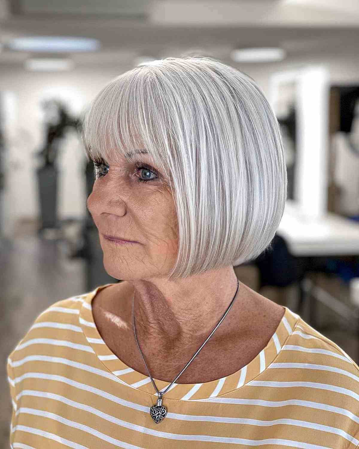 Elegant Gray Bob with Light Bangs for Ladies 70 and Up