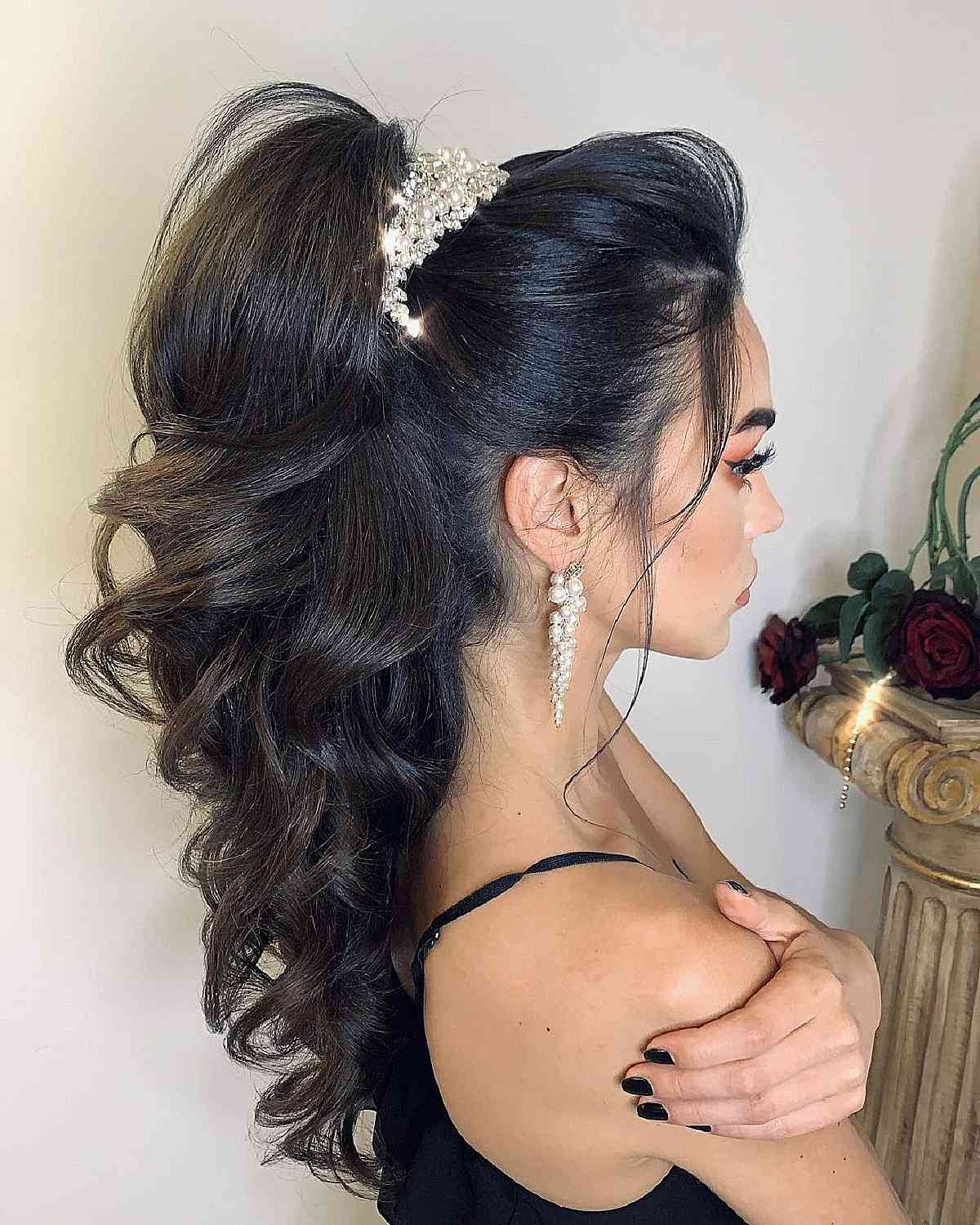 Elegant high ponytail with bouncy curls