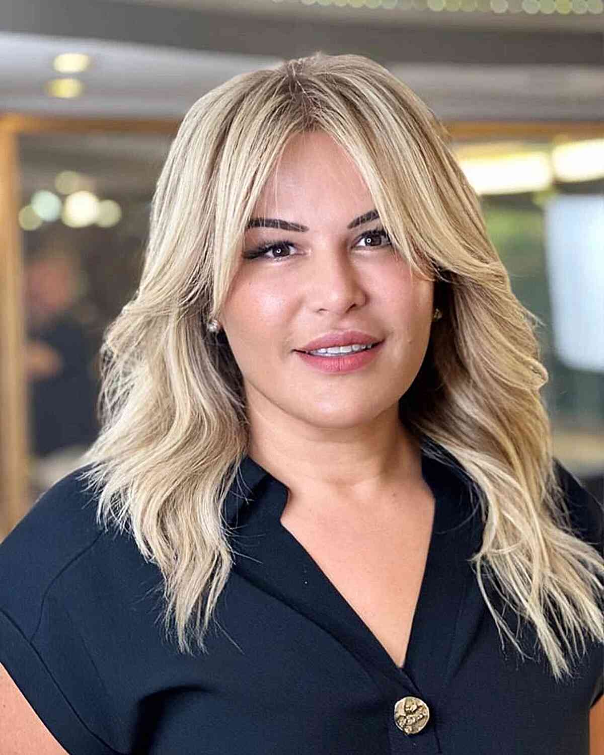 Mid-Length Elegant Layers with Soft Curtain Bangs for Round Faces