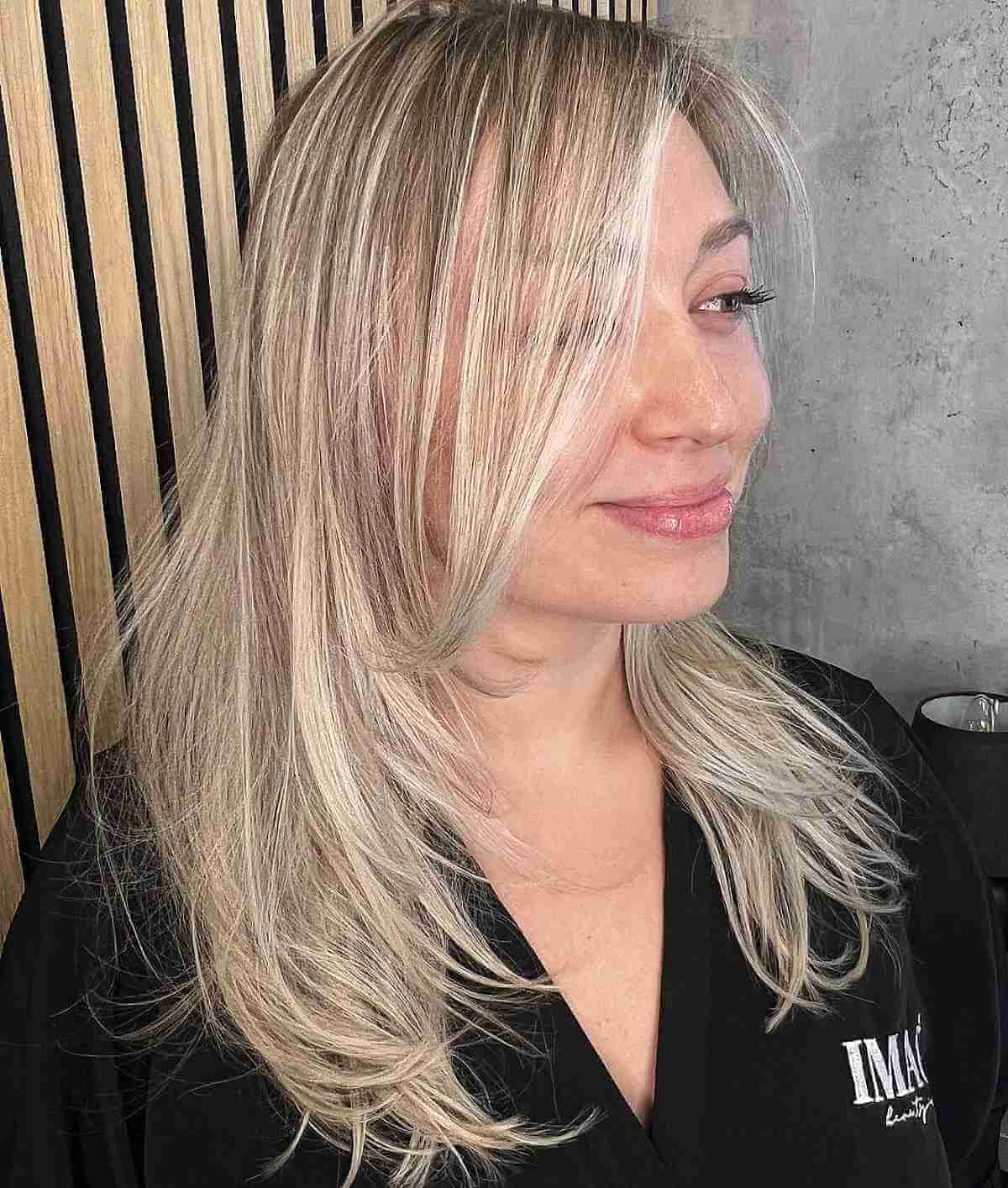 Elegant Long Blonde Layers with Face-Framing Accents for Thinning Hair