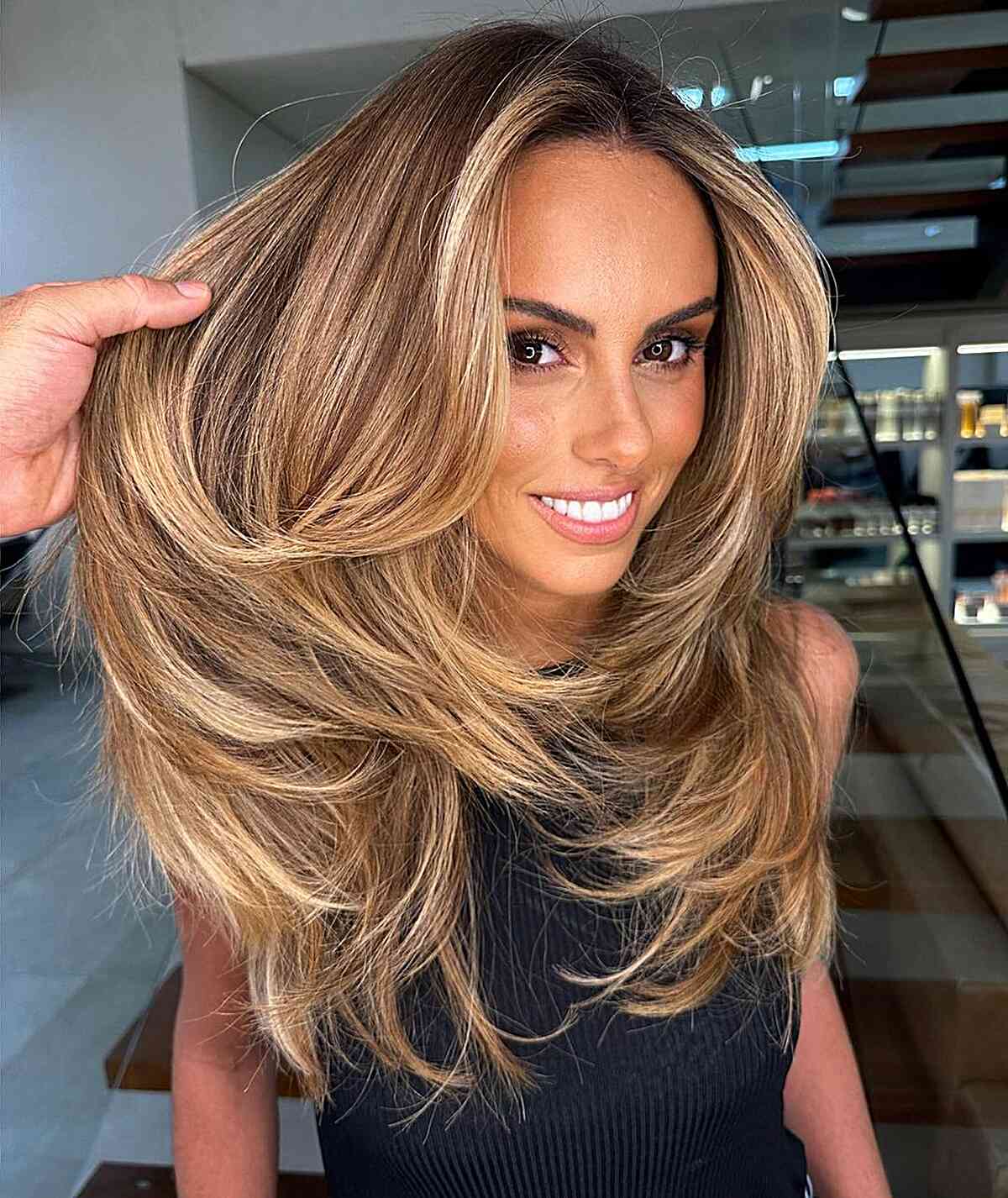 Elegant Long Blowout with Medium Blonde Balayage and Layers for Thick Hair