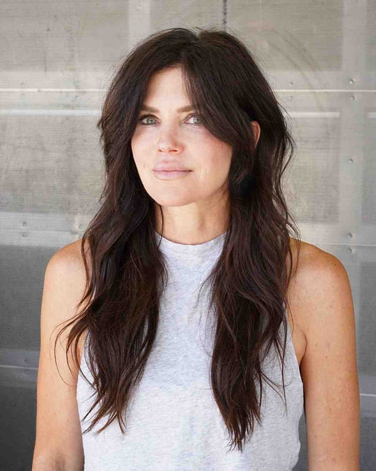 Elegant Long Layered Brunette Hairstyle for Women Over Forty