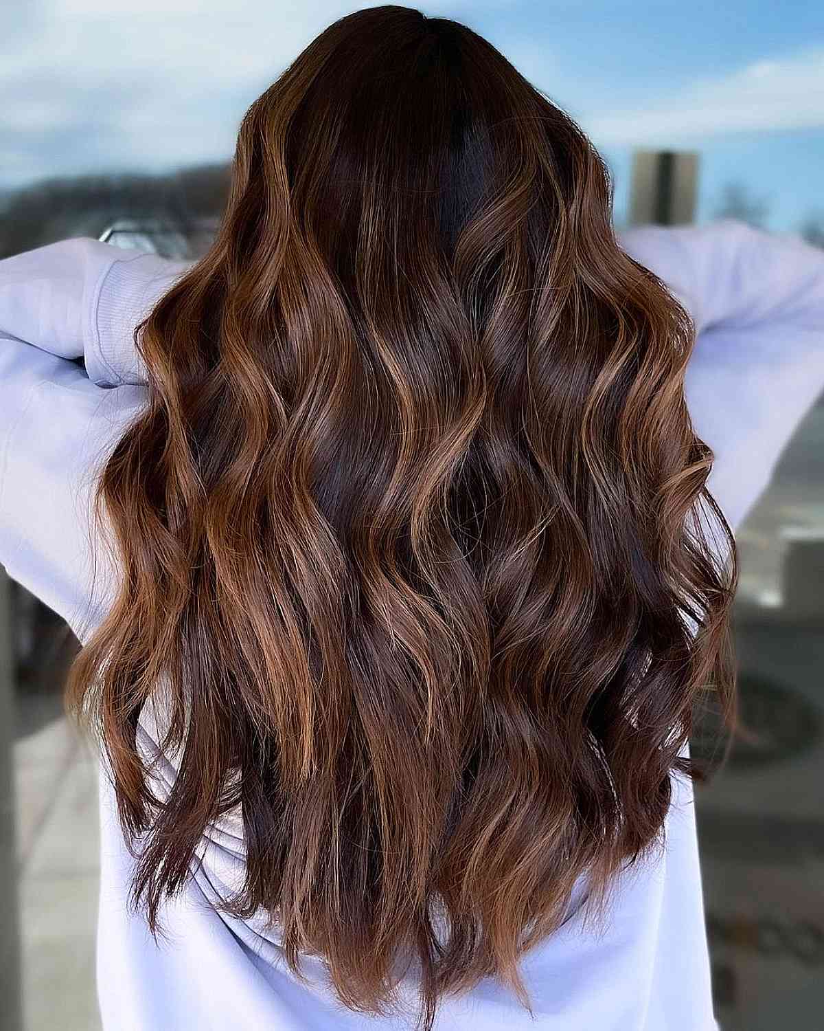 Elegance of Long Layers and Caramel Highlights
