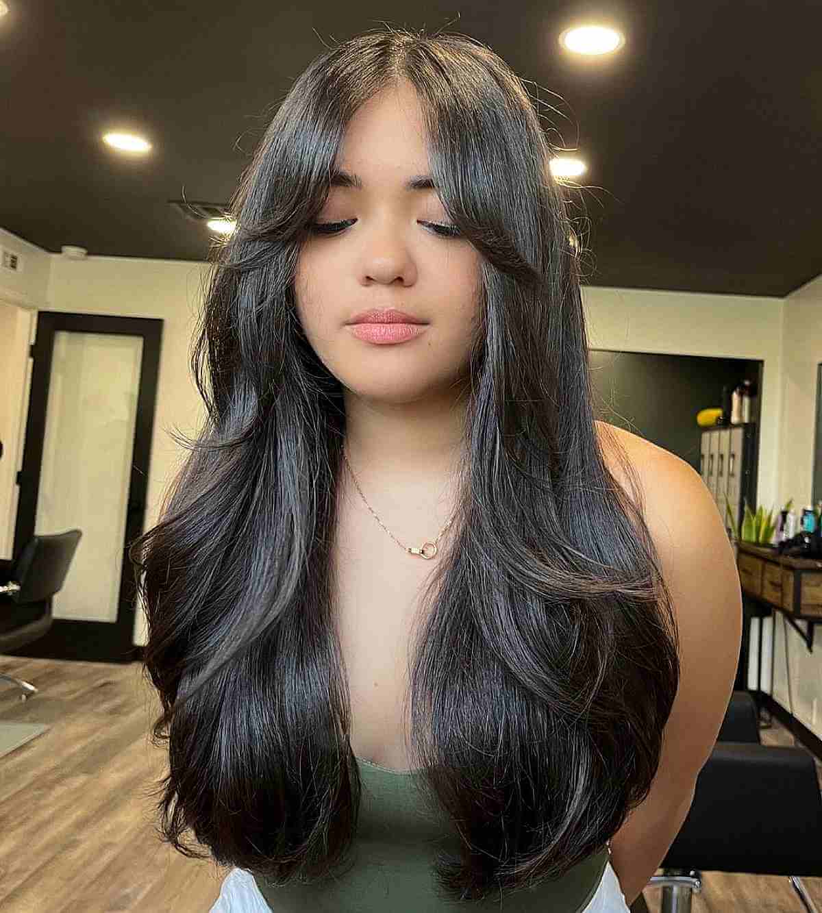 Elegant Long Layers with Gentle Curtain Bangs on Straight Hair