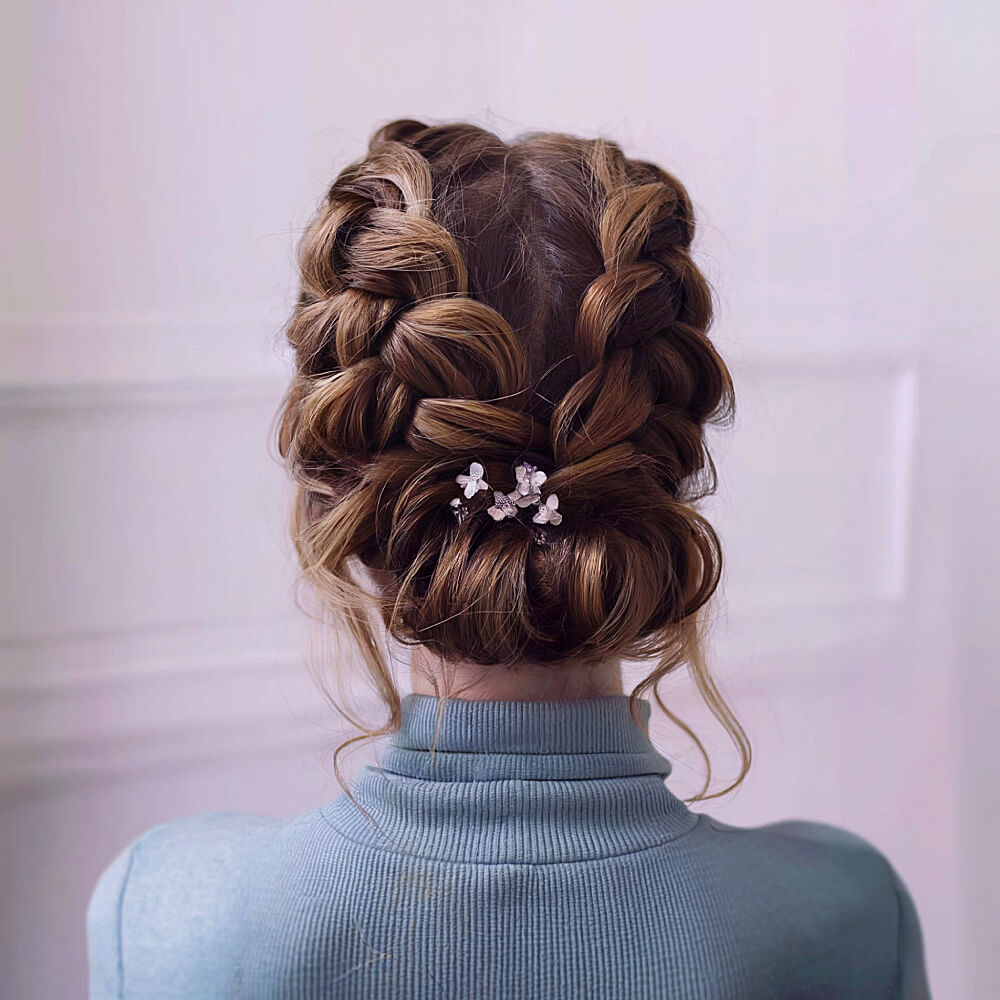Elegant Low Bun Featuring Double Dutch Braids