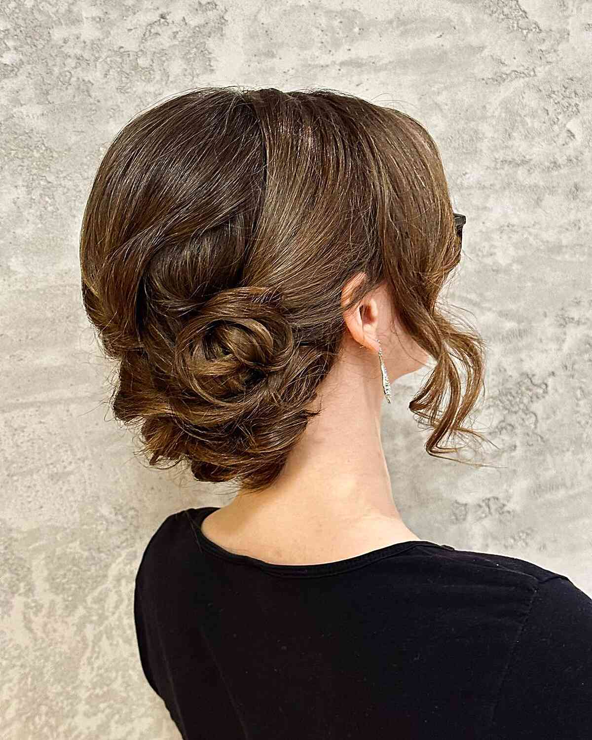 Elegant Medium-Length Low Bun with a Face Frame