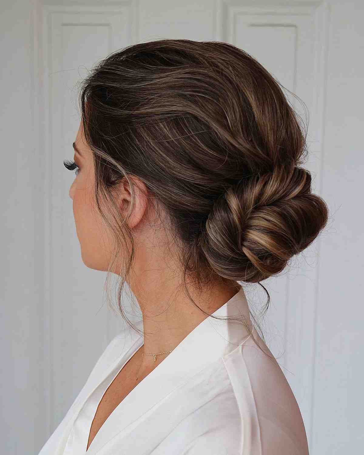 Elegant low twisted bun updo for weddings