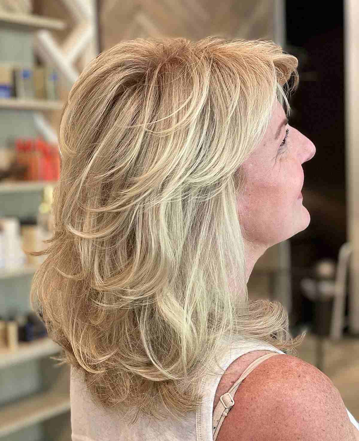 Elegant Mid-Length Blonde Hair with Feathered Layers For Women Past Their 40s