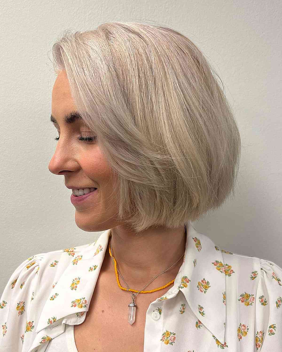 Elegant Pale Neck-Length Blonde Bob for Mature Women