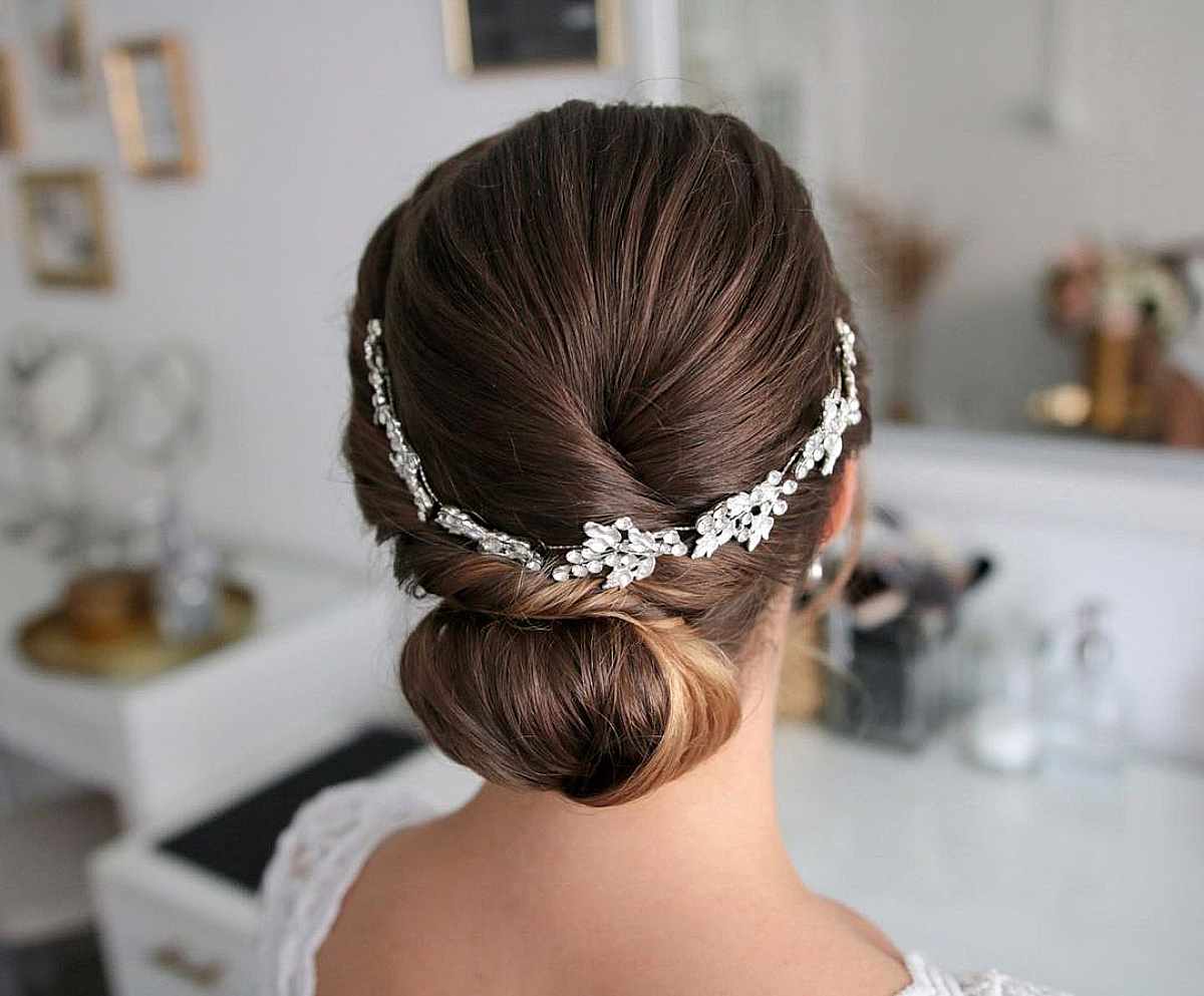Stylish Mid-Length Rolled Down-Do with a Vine Hairpiece