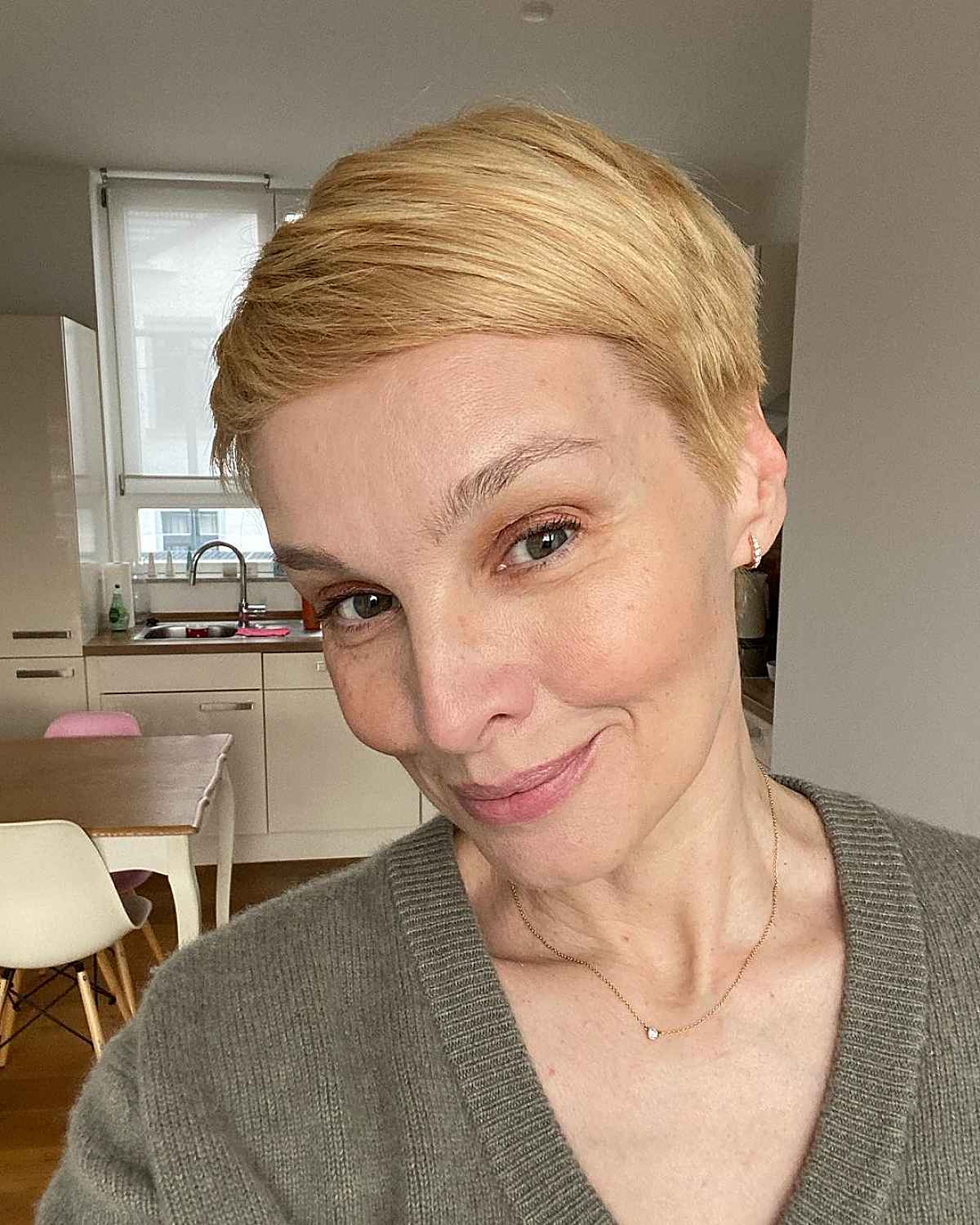 Chic Side-Swept Pixie Hairstyle for Women Over 50 with Fine Hair