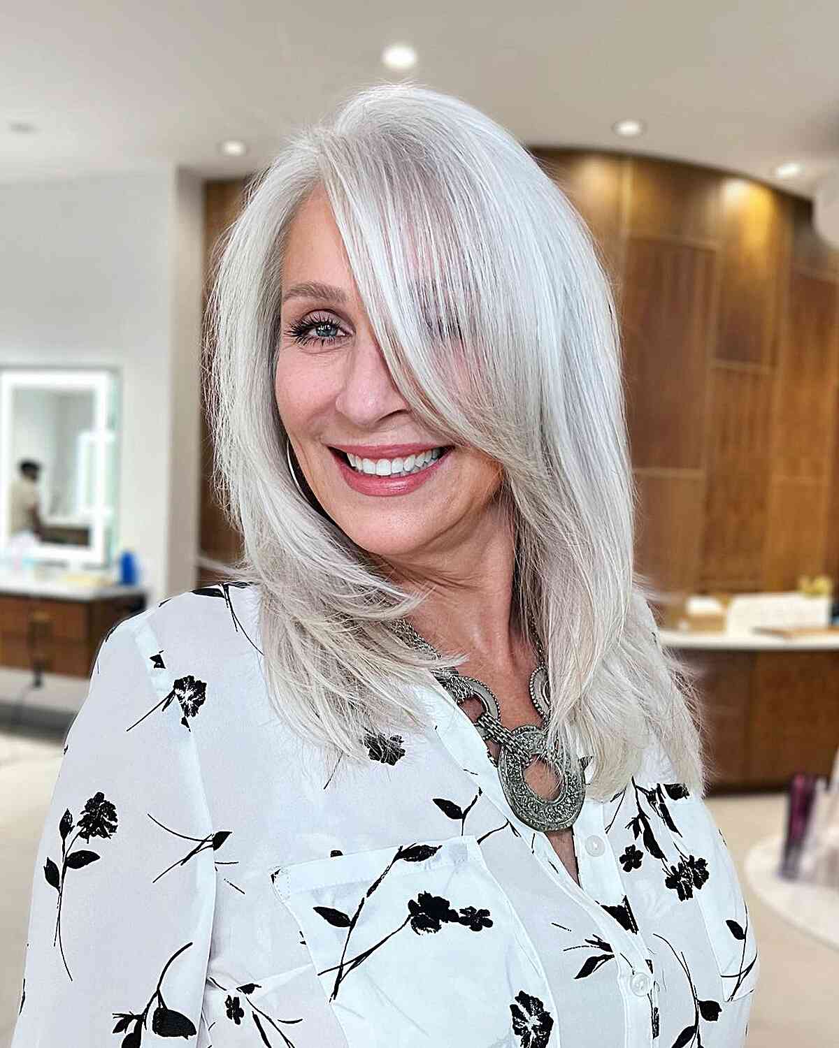 Sophisticated Silver Layered Cut for Medium-Length Hair and women with an oval face