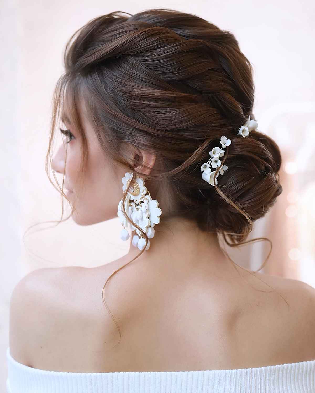 elegant, soft and refined wedding updo hairstyle