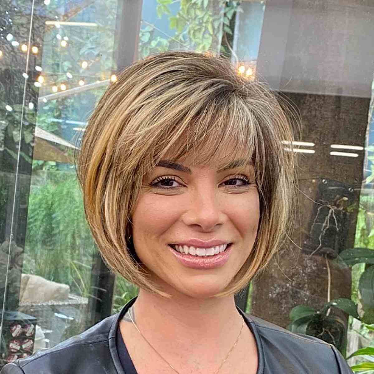 Elegant Soft Blonde Short Bob with Wispy Bangs