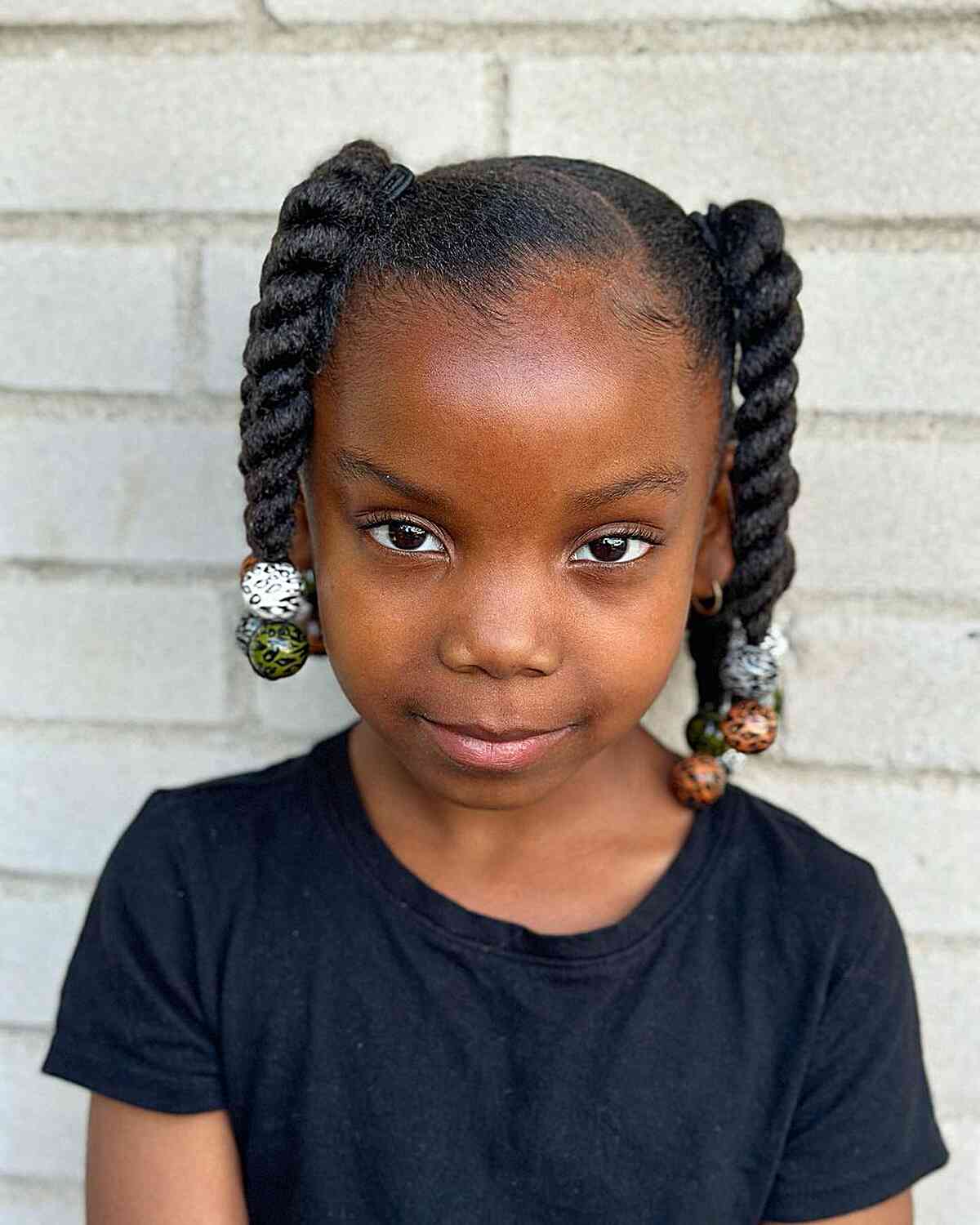 Elegant twisted pigtails for young girls