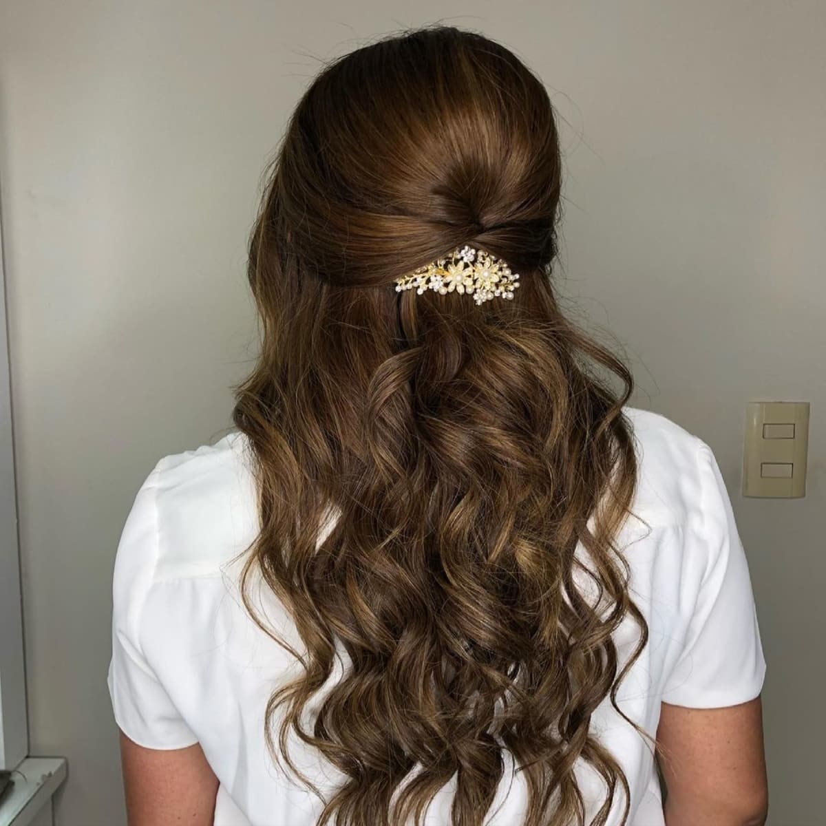 Elegant wavy half-up professional hairstyle