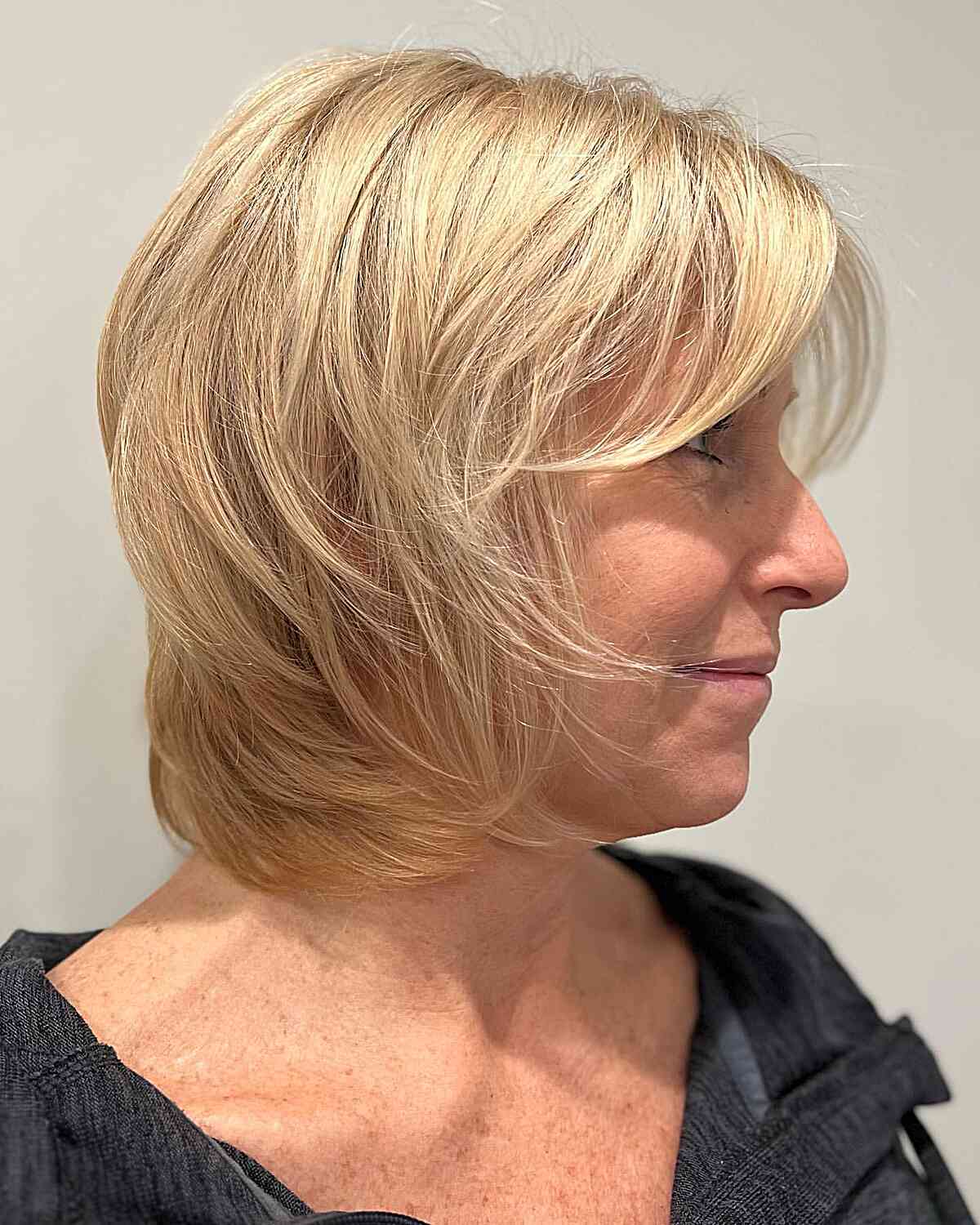 Neck-Grazing Elegant Wispy Shag with Face-Framing Bangs for Fine-Haired Mature Women
