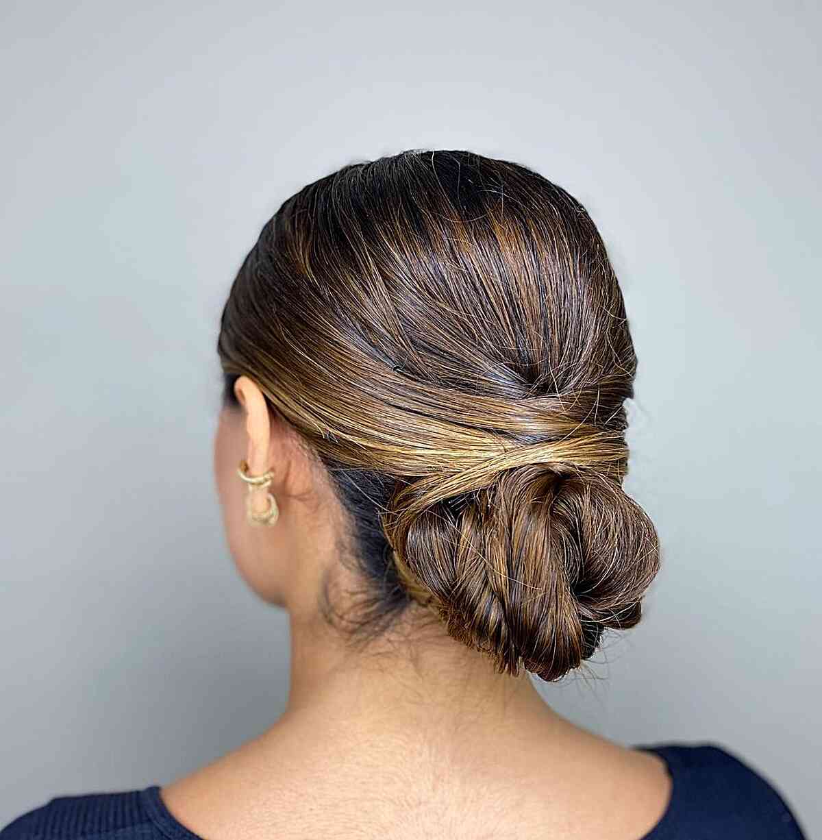 Elegant Wrapped Bun Low Updo on Thick-Haired Ladies