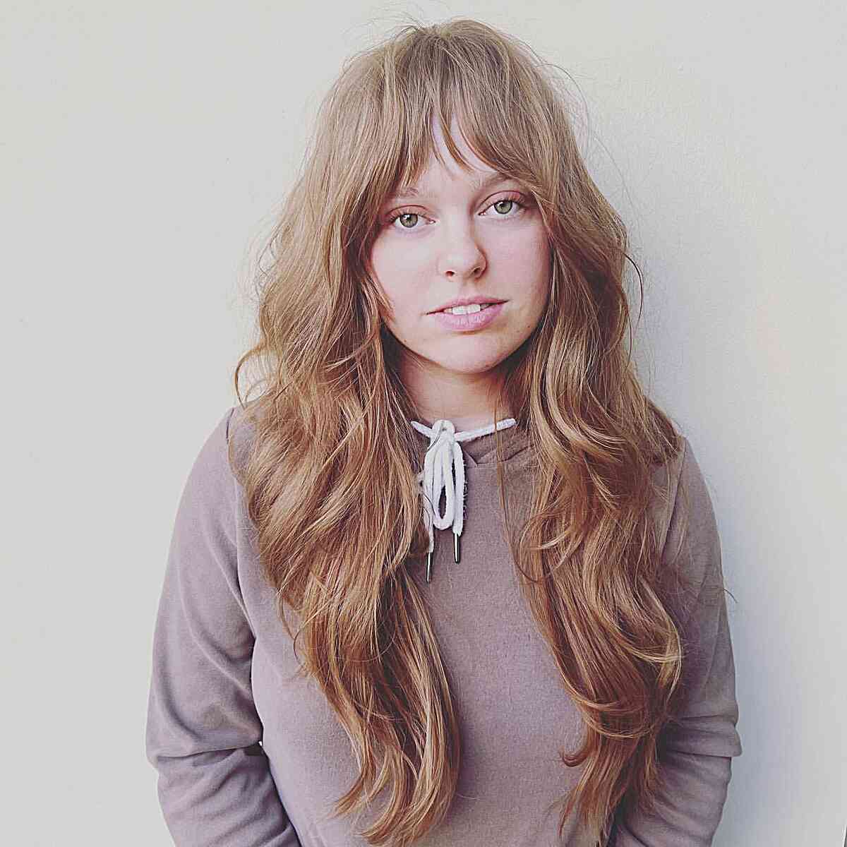 Enchanting Long Shaggy Hair with Bangs for women with heart faces