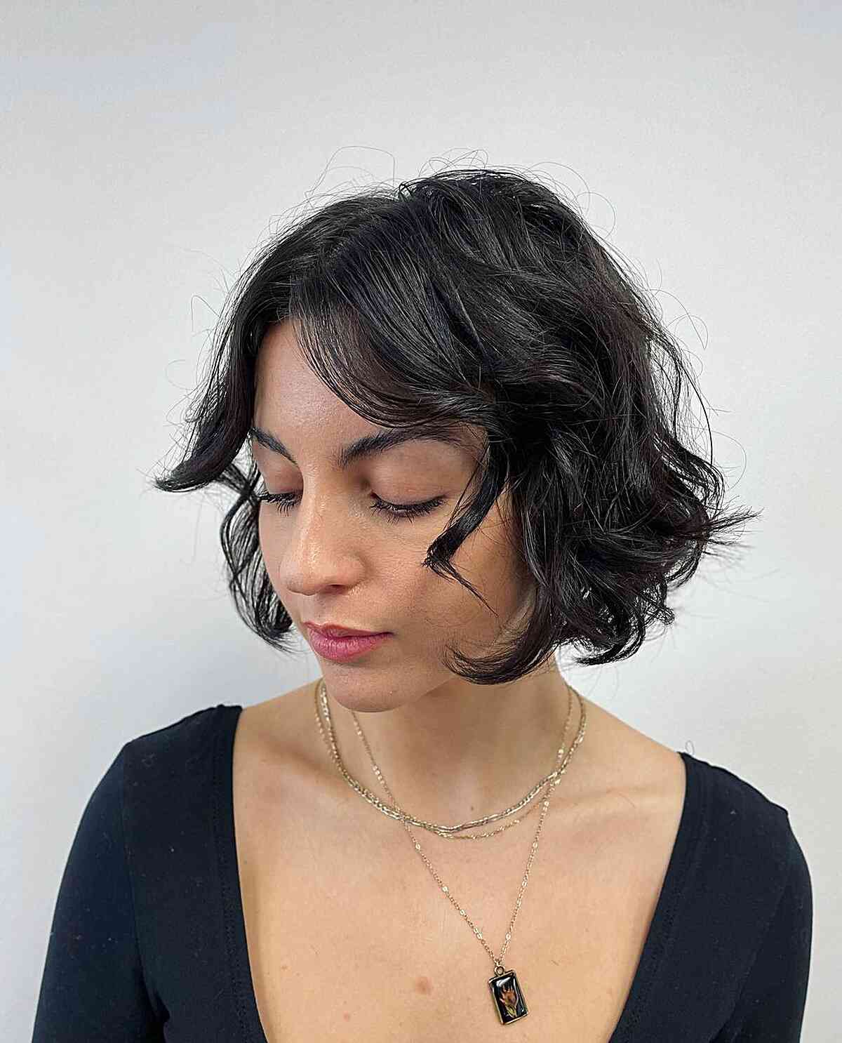 Feathery French Bob Hairstyle with Curled Curtain Bangs for Fine Hair